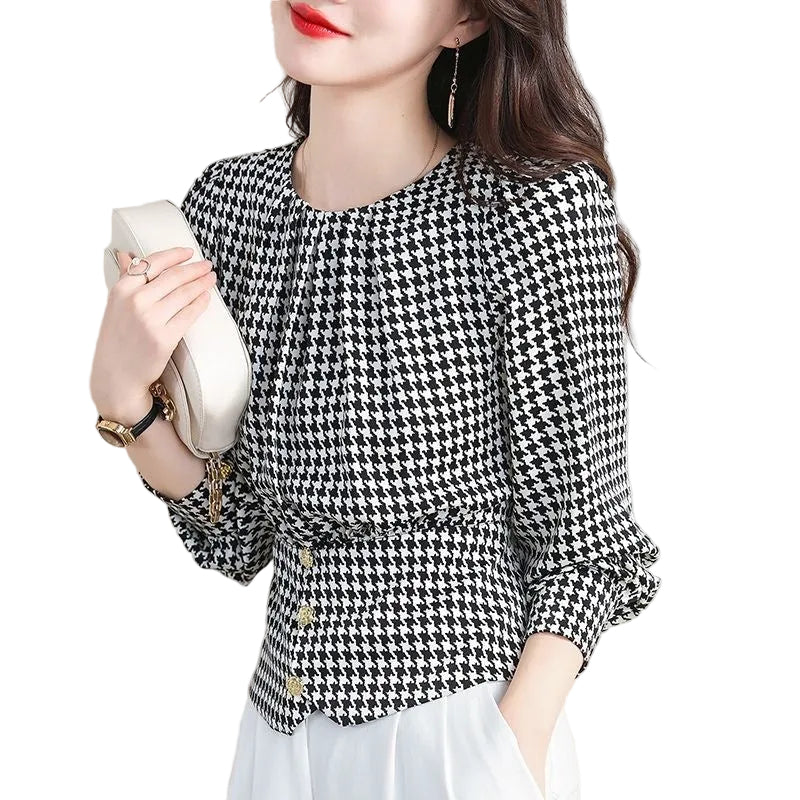 Detail of the chic neckline and tailored armhole trim on the blouse