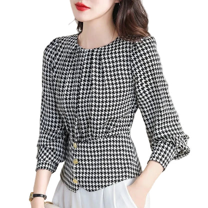 Flat lay styling of the women's luxury-inspired houndstooth pullover