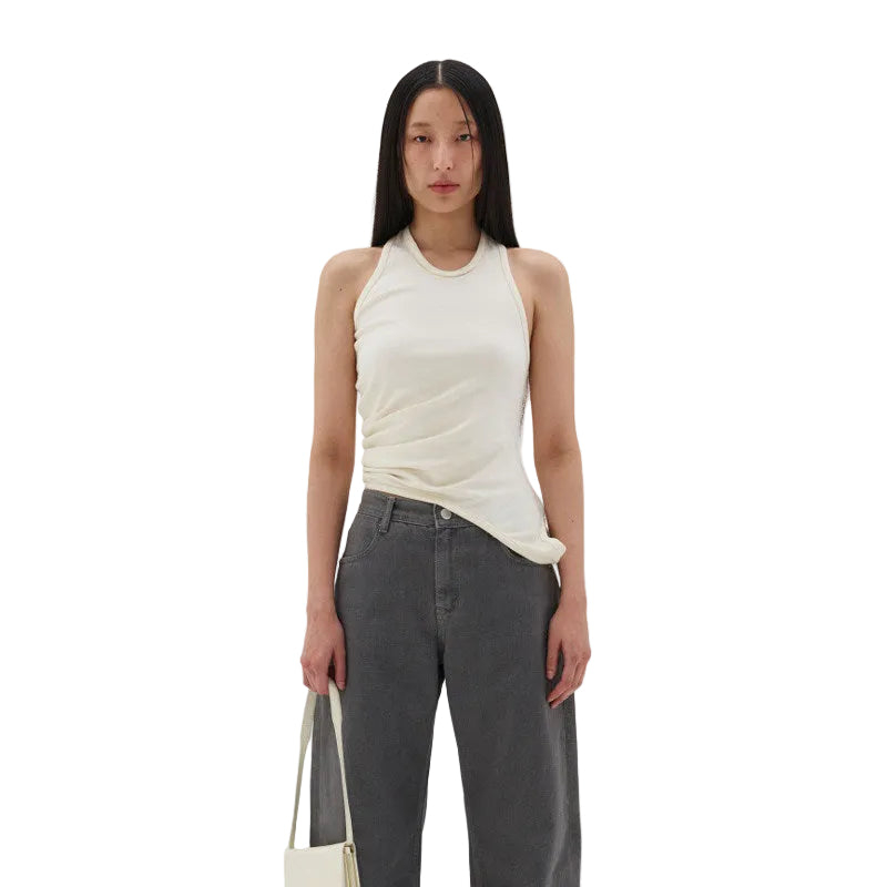 Close-up of the smooth, high-stretch fabric texture on the women's top