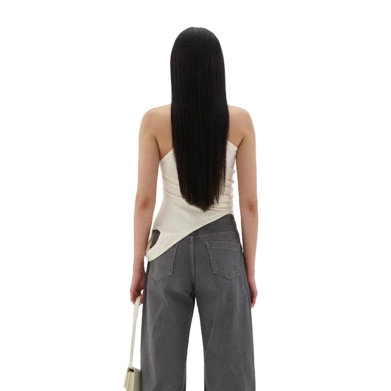 Detail of the elegant scoop neckline and refined strap construction