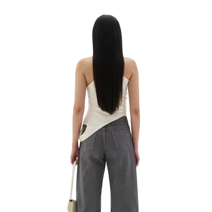 Detail of the elegant scoop neckline and refined strap construction