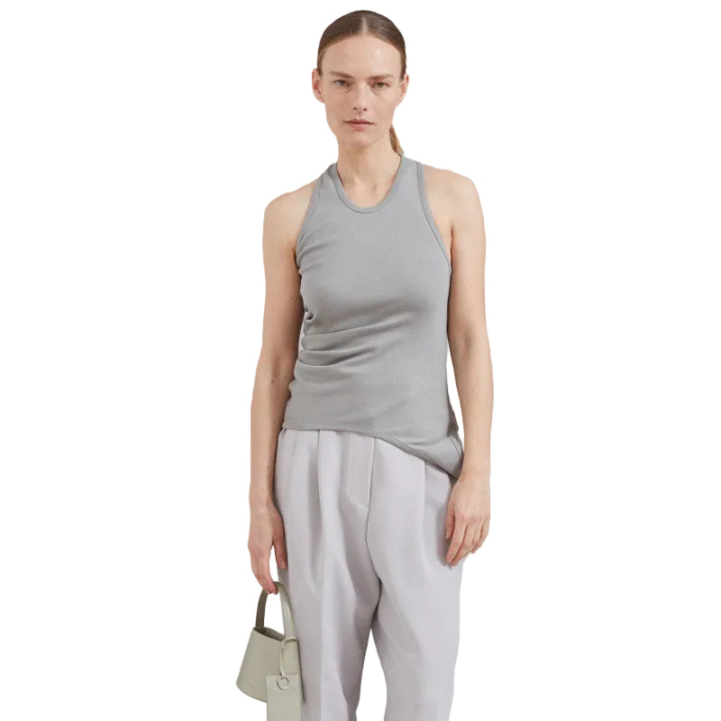 Side profile of a model wearing the slimming backless sleeveless tank top